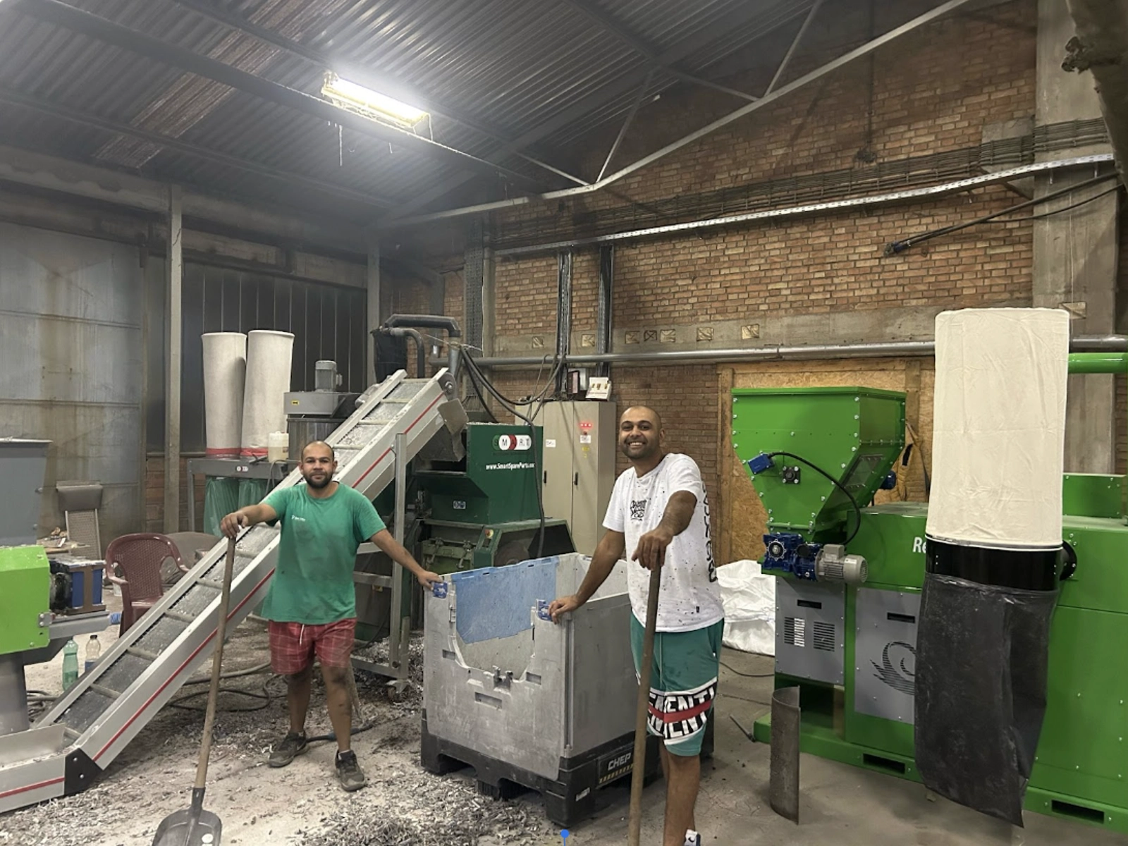 Kilino Stojkov and his colleague in their recycling centre in Novo Milosevo.