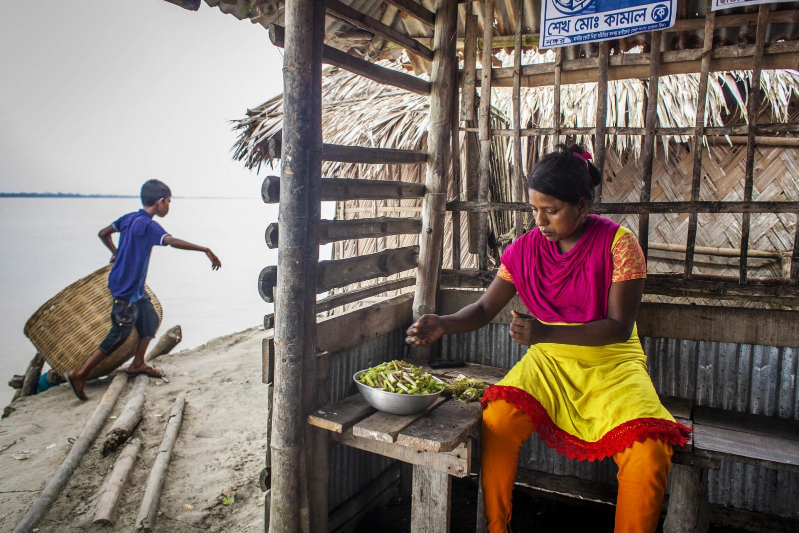 Bangladesh's early-warning system for cyclones saved millions of lives when Cyclone Amphan hit the country in 2020. However, the cyclone still caused immense damage, destroying thousands of homes and livelihoods. Photo by UN Women/Fahad Kaizer