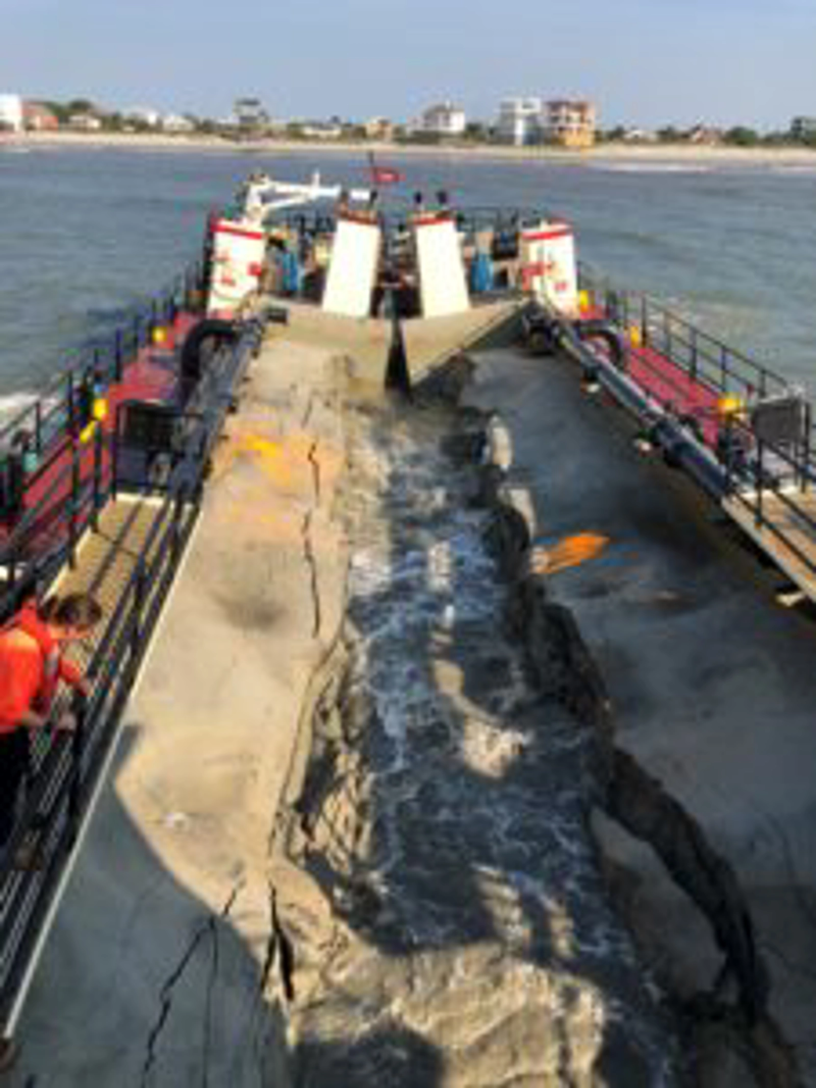 Placing sand in the nearshore at Folly Beach south of Charleston using a small hopper dredge. Image: USACE.
