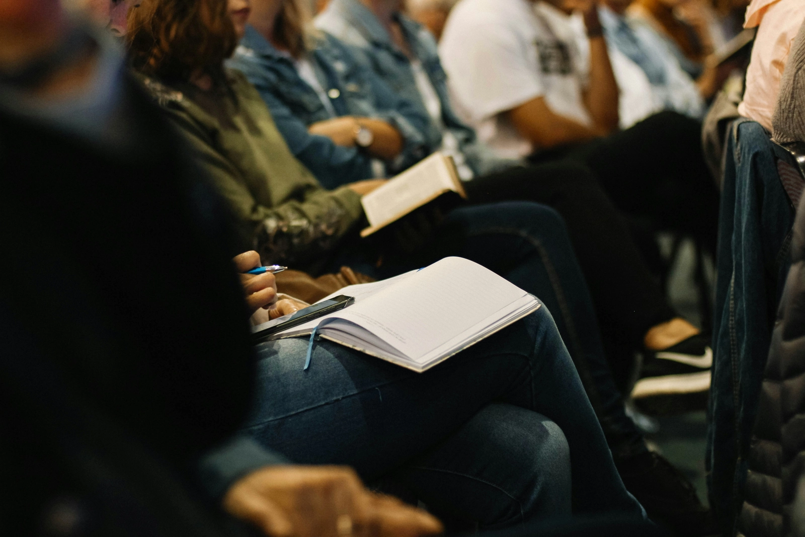Person taking notes at event