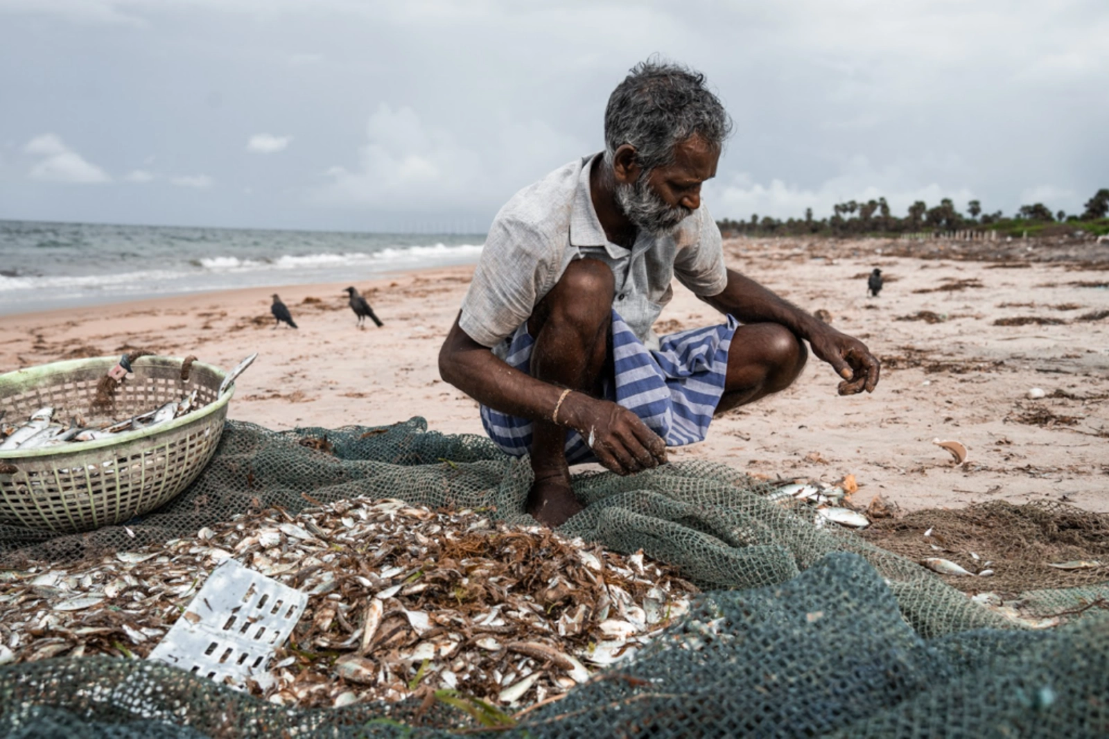Meeting lifelong local fishermen with Hafsa who have been impacted by climate change. Photo Credit: Marla Tomorug