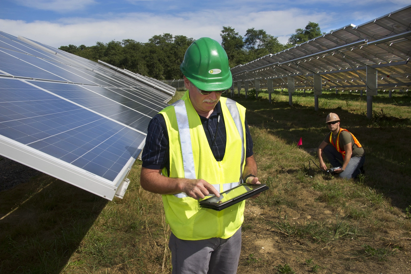 | Image: Workers at the the Long Island Solar Farm